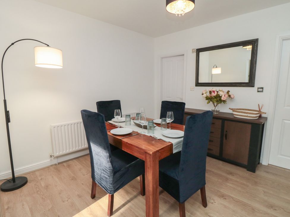 A dining room with a table and chairs at 23 South Lackenby Eston
