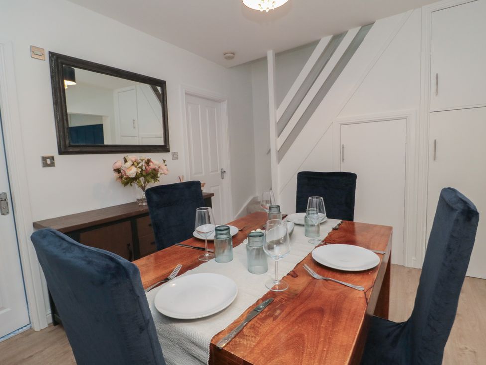 A dining room with a wooden table and chairs at 23 South Lackenby in Eston