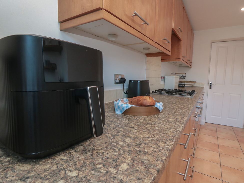 A kitchen with an air fryer and bread on a countertop at 23 South Lackenby in Eston
