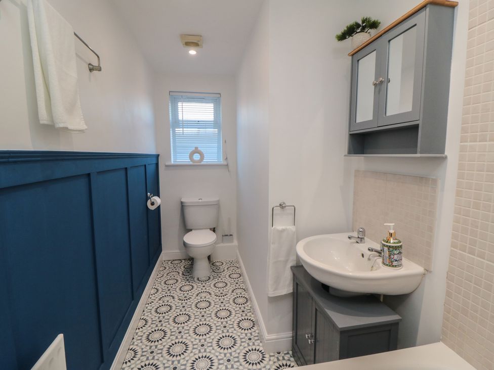 A bathroom with a toilet and sink at 23 South Lackenby in Eston