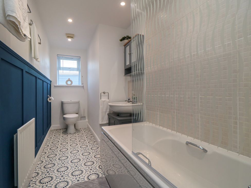 A bathroom with a bathtub, toilet and sink at 23 South Lackenby in Eston