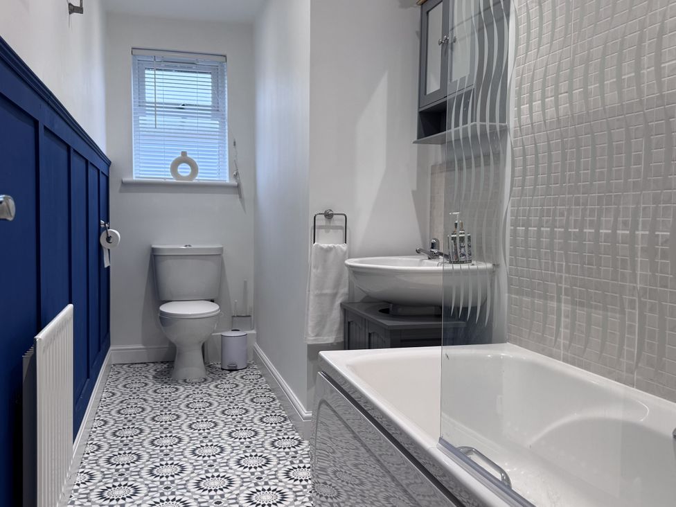 A bathroom with a toilet and sink at Ironstone Cottage in Eston