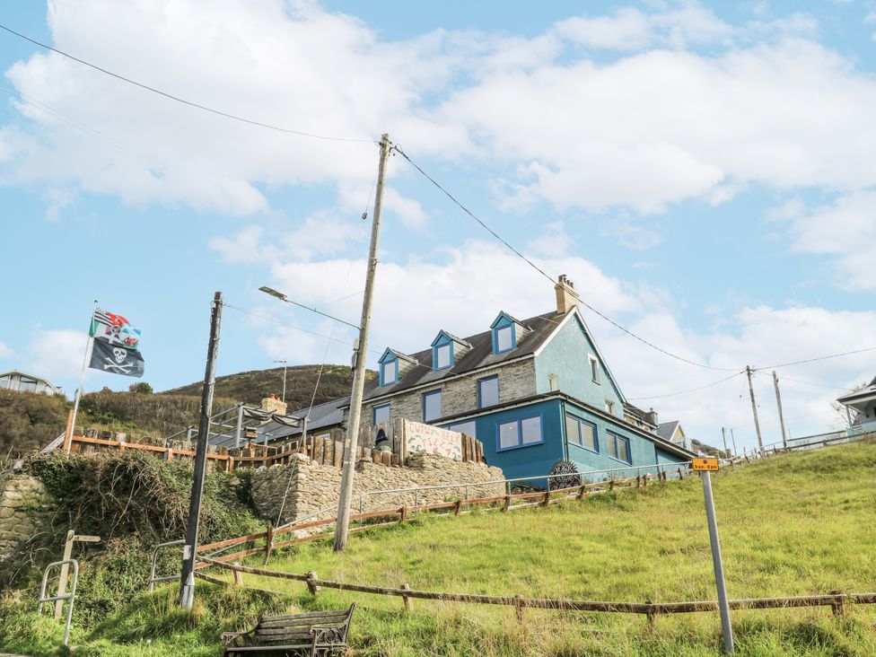 A house with a garden and flag at Awel Deg, Tresaith