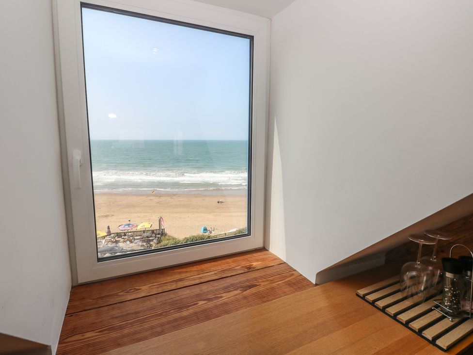 A view of the beach and ocean from a room at Awel Deg, Tresaith