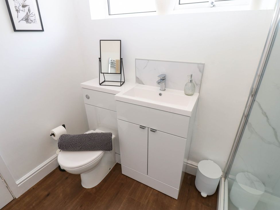 A bathroom with a toilet and sink at Ashtree Cottage