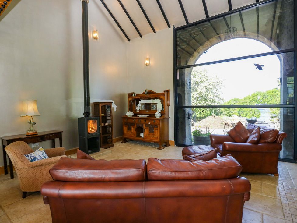 A living room with a sofa and armchair at Bib Knowl Farm in Littleborough