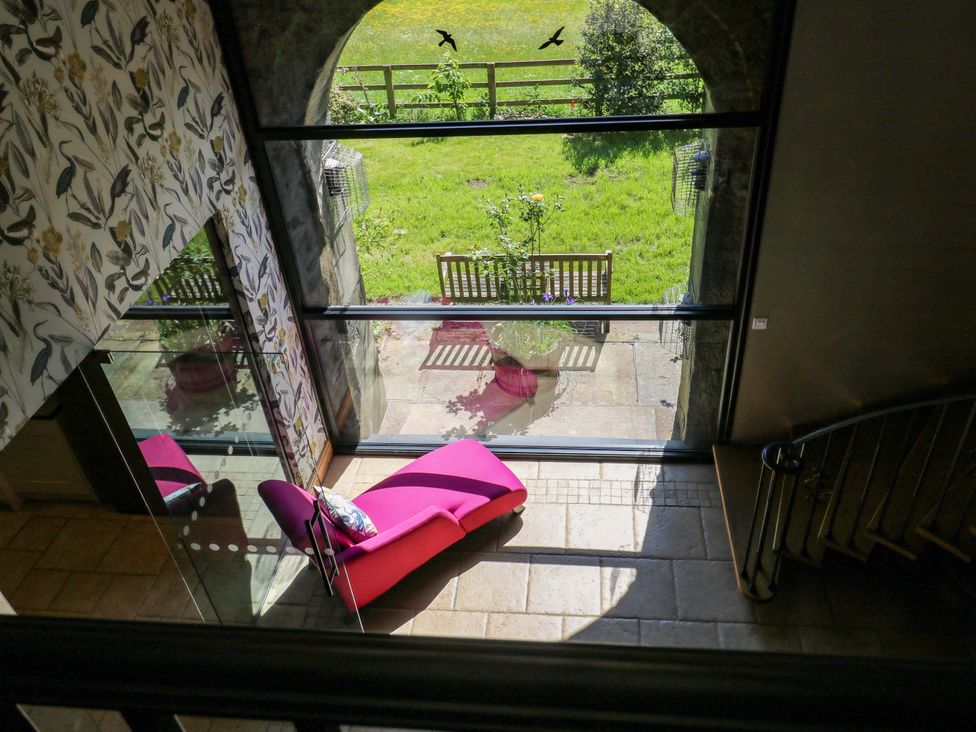 A seating area with a view of the garden at Bib Knowl Farm in Littleborough
