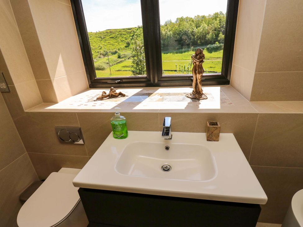 A bathroom with a sink and toilet at Bib Knowl Farm in Littleborough