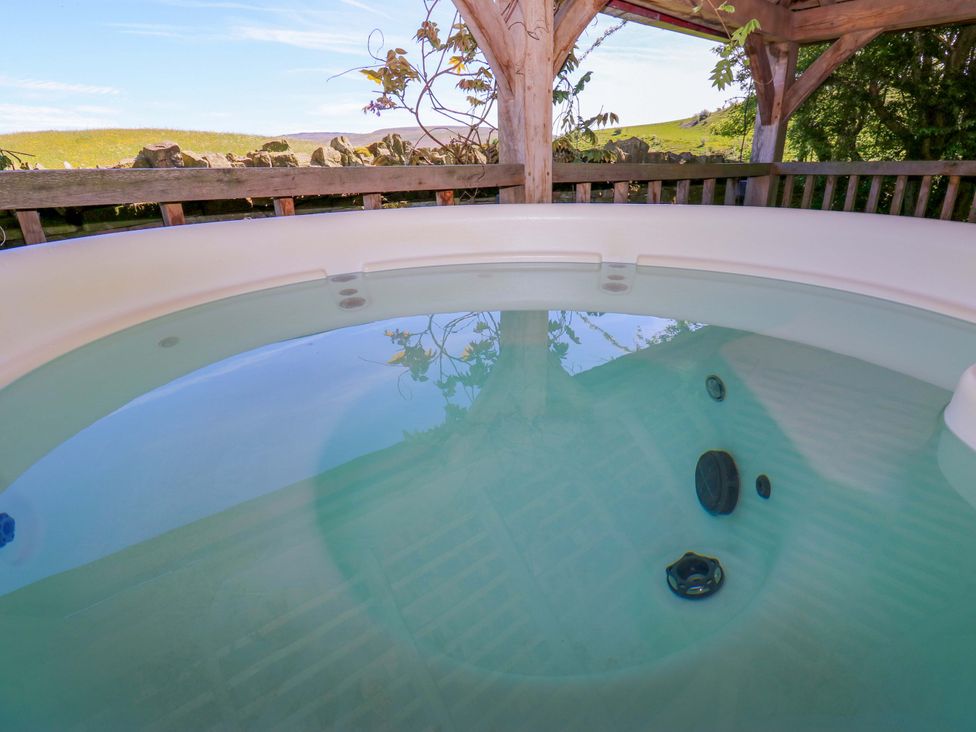 A hot tub with water at Bib Knowl Farm in Littleborough