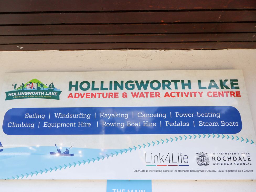 Hollingworth Lake Adventure and Water Activity Centre sign listing activities in Littleborough