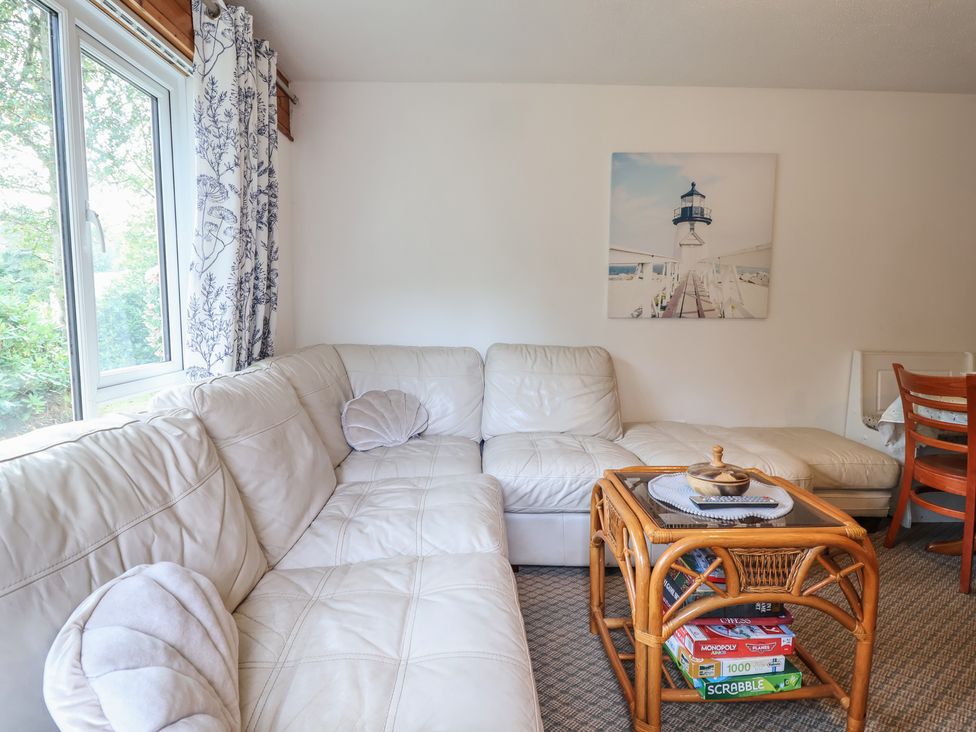 A living room with a sofa and coffee table at Manorcombe 1 in Honicombe Park near Gunnislake