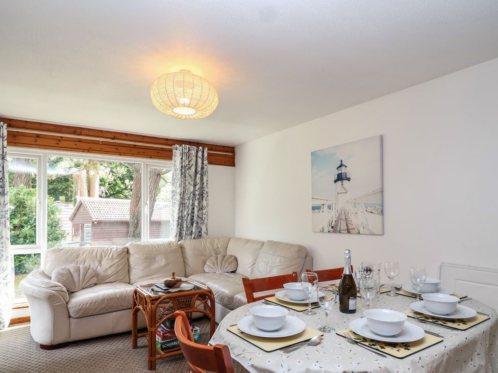 A dining room with a table set for dinner at Manorcombe 1 Honicombe Park near Gunnislake