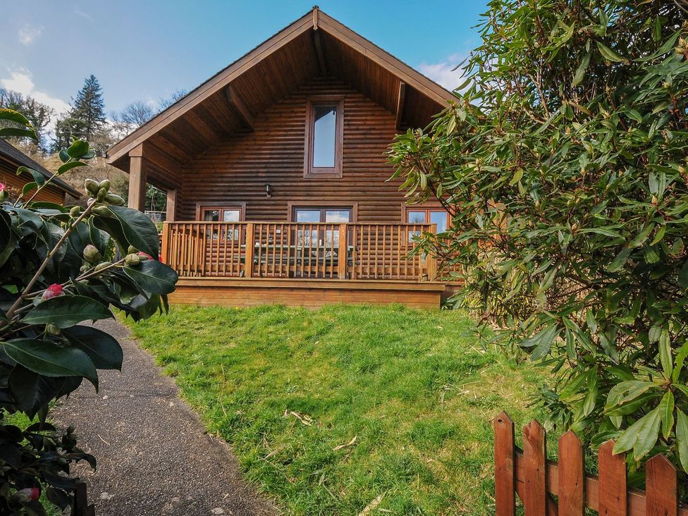 A log cabin with decking and grass at Eden in St Breward