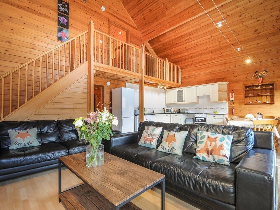 A living room with a sofa and coffee table at Heligan, St Breward