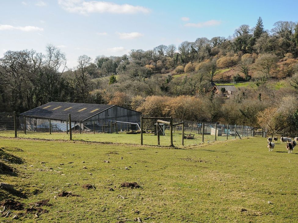 A farm scene with a barn and sheep at Heligan in St Breward