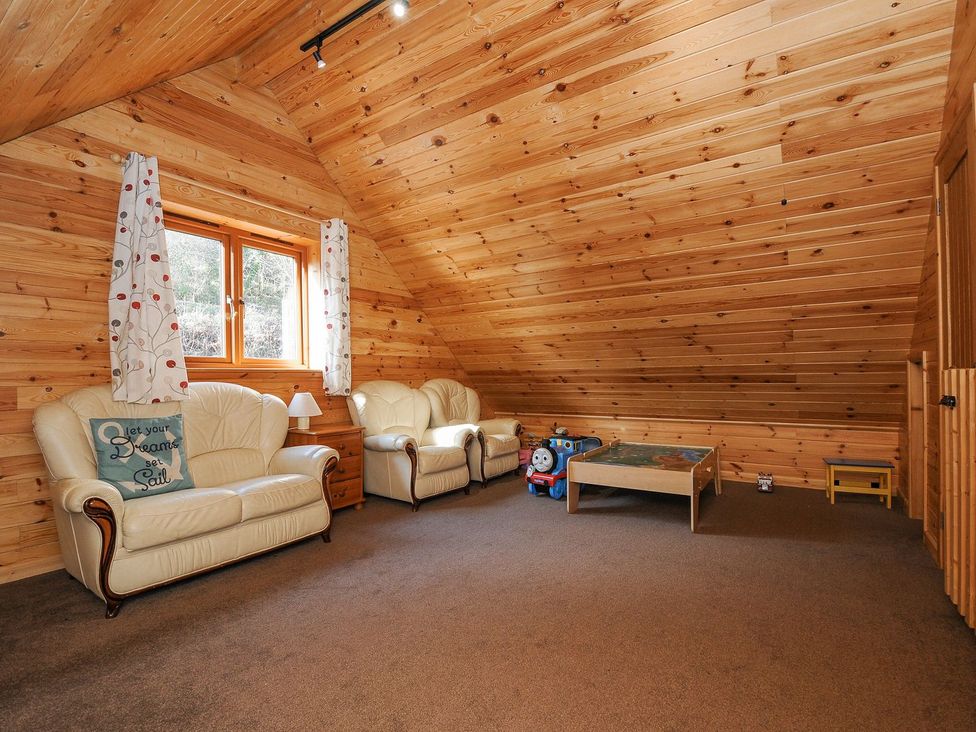 A snug with sofas and a table at Polzeath in St Breward