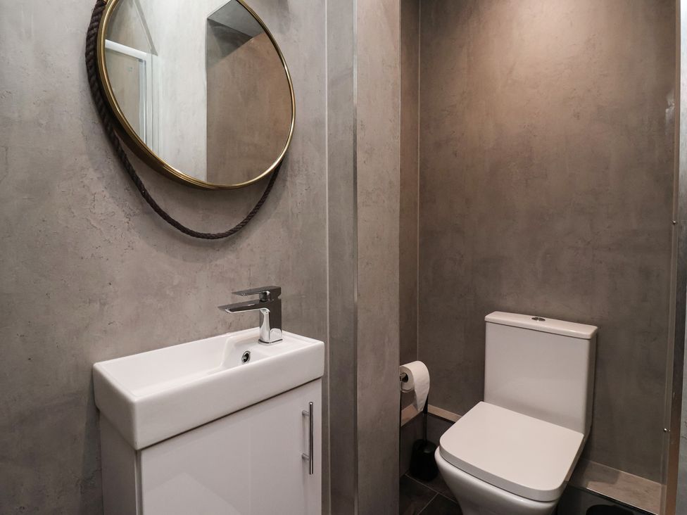 A bathroom with a sink and toilet at Flat 9 York