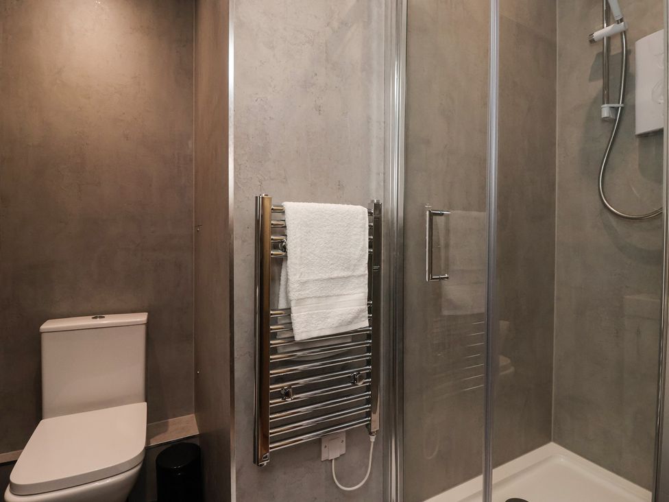 A bathroom featuring a toilet and a shower at Flat 9 in York