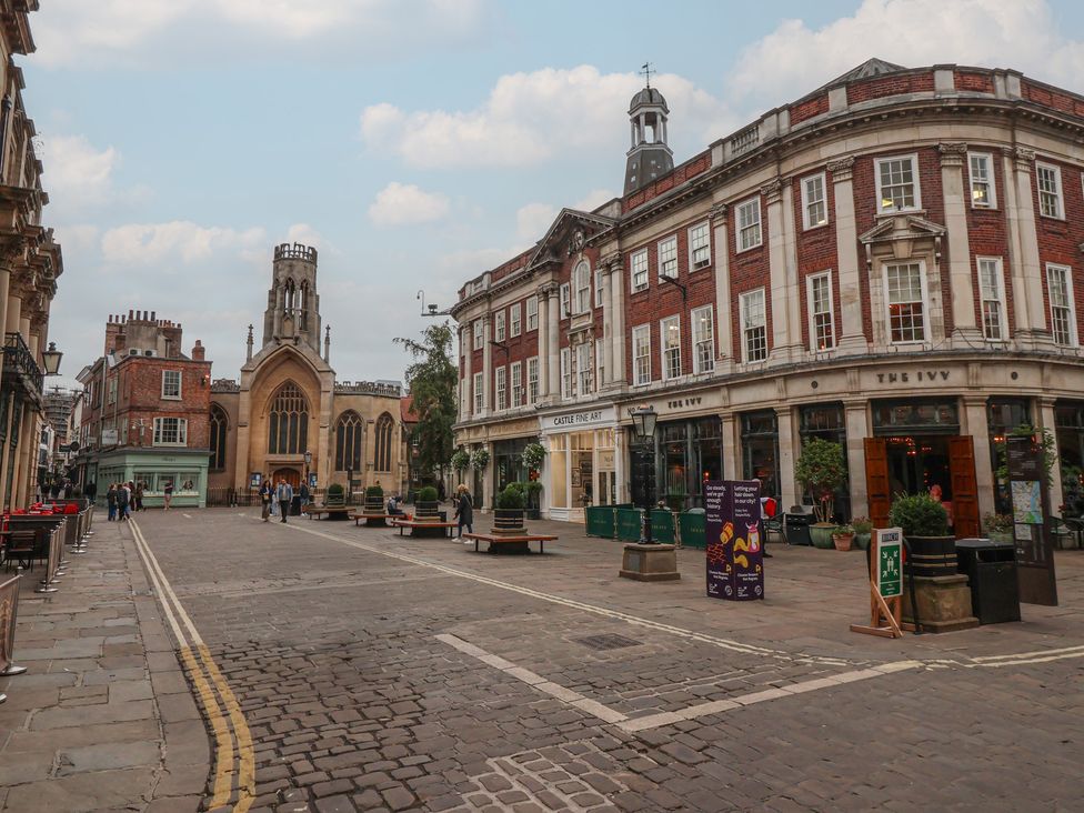 A street with buildings and church at Flat 9 in York