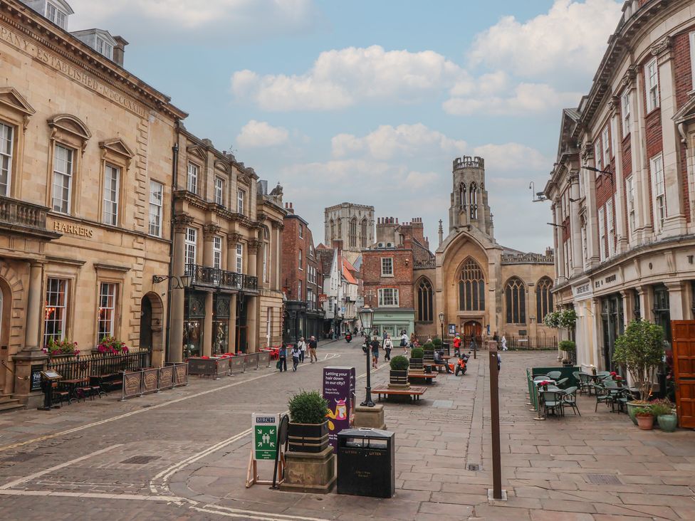 A street with buildings and a church at Flat 9 in York