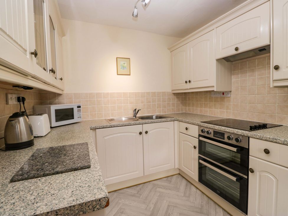 A kitchen with a sink and stove at Buckbarrow Seascale