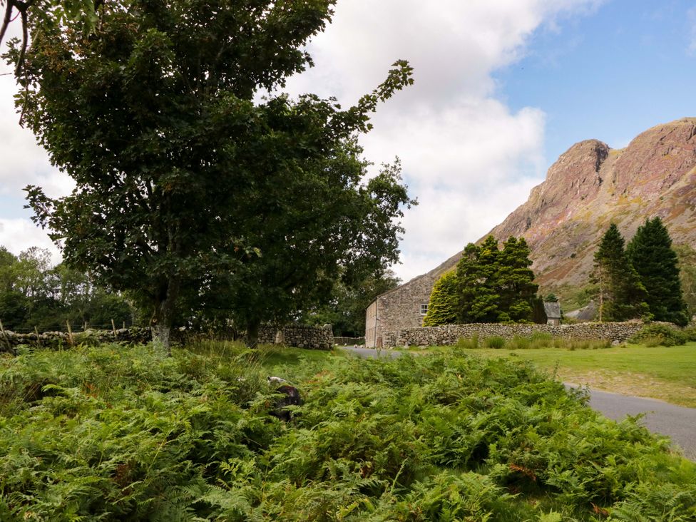A landscape with a building and mountain at Buckbarrow in Seascale