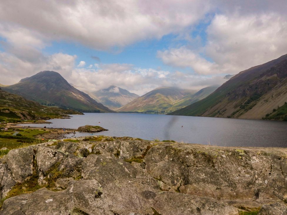 A scenic view of a lake surrounded by mountains at Buckbarrow in Seascale