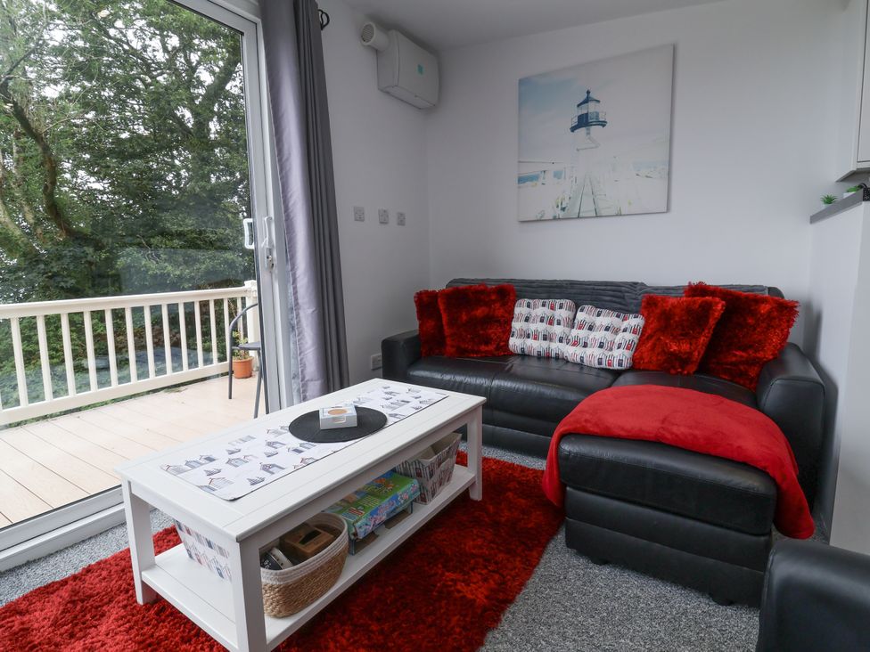 A living room with a sofa and coffee table at I C Lundy Too Bideford Bay Holiday Park near Woolfardisworthy