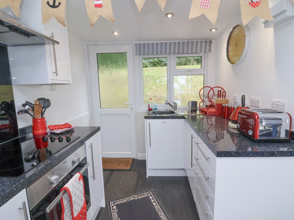 A kitchen with appliances and utensils at I C Lundy Too Bideford Bay Holiday Park near Woolfardisworthy