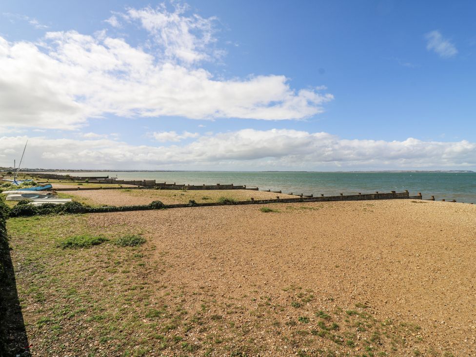 A beach with boats on the sand at 14 Marine Terrace Whitstable