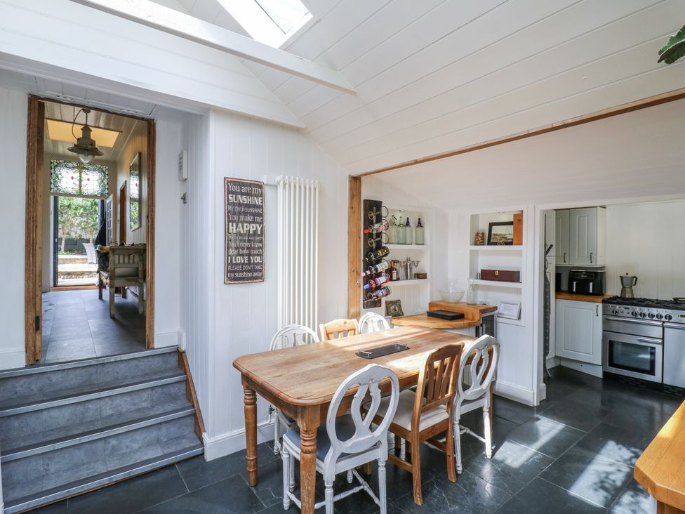 A kitchen with a dining table and chairs at 14 Marine Terrace in Whitstable