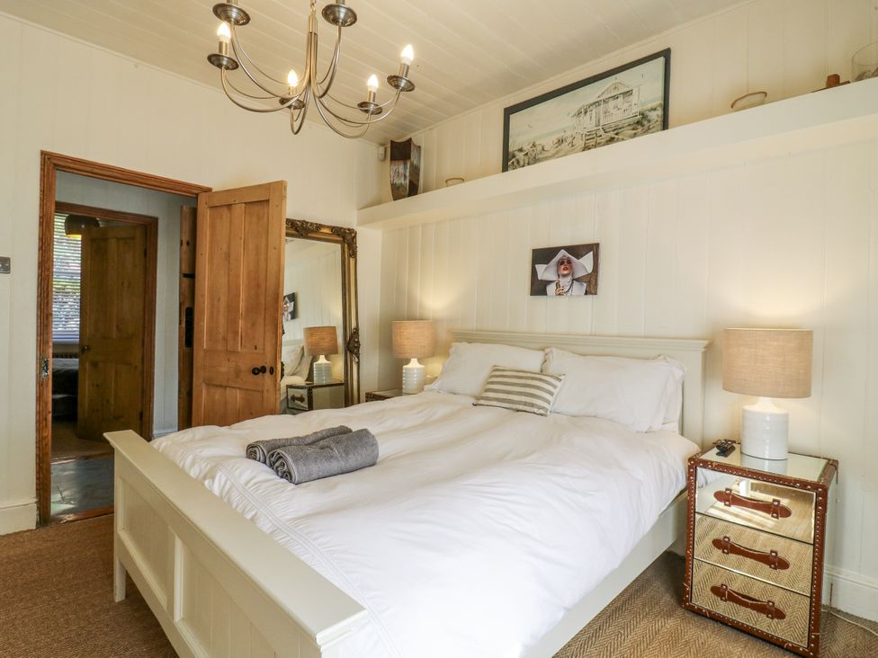 A bedroom with a bed and lamps at 14 Marine Terrace in Whitstable