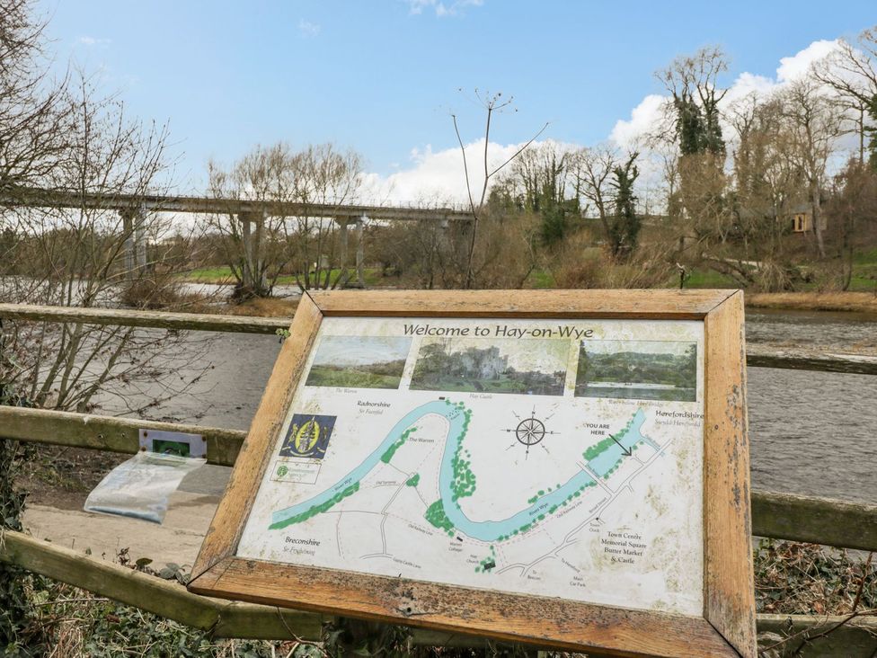 An information sign with a map by a river at Cariad Cottage Hereford