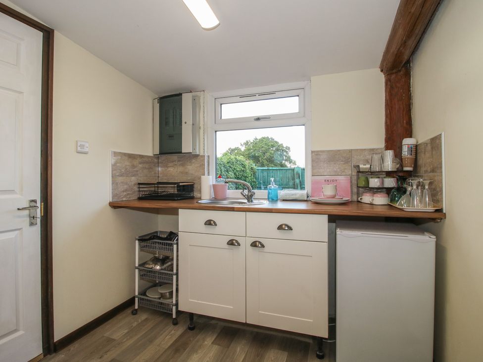 A kitchen with a sink and countertop at Sharon's Shepherd Hut in Oswestry