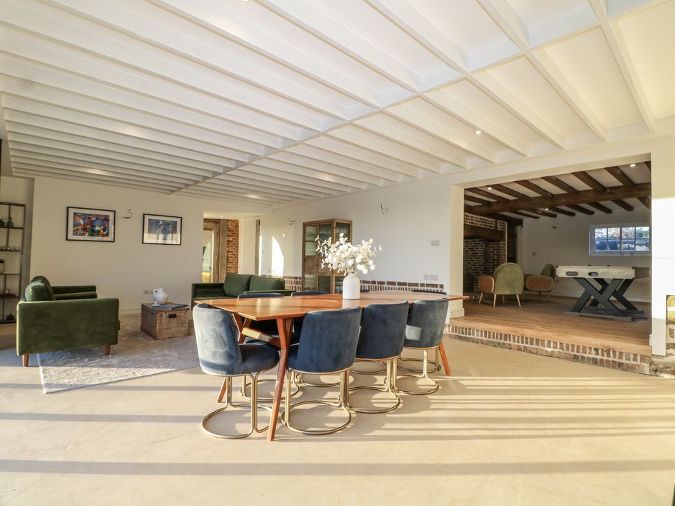 A dining area with a table and chairs at the Farm house in 