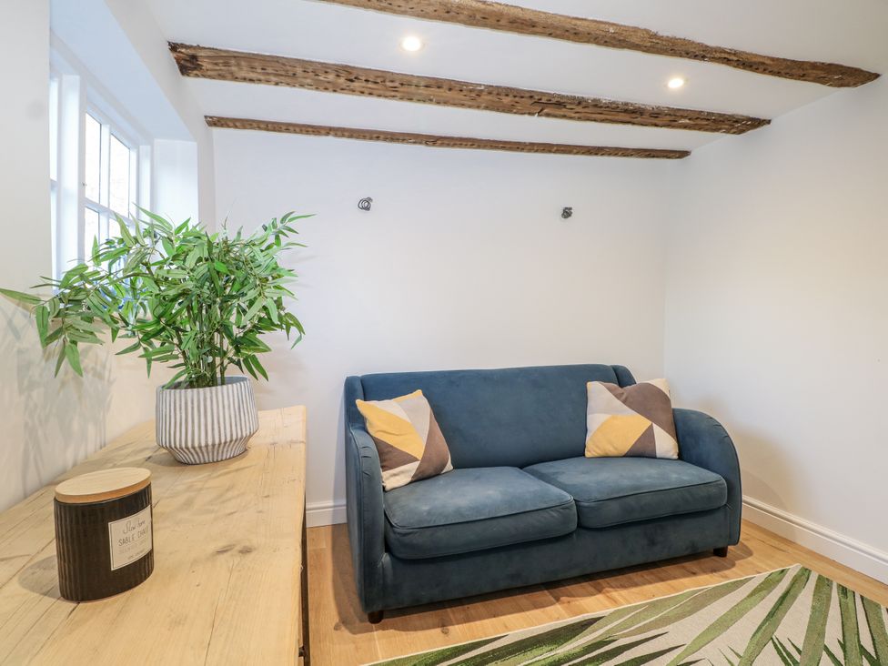 A living room with a sofa and plant at Farm house in 