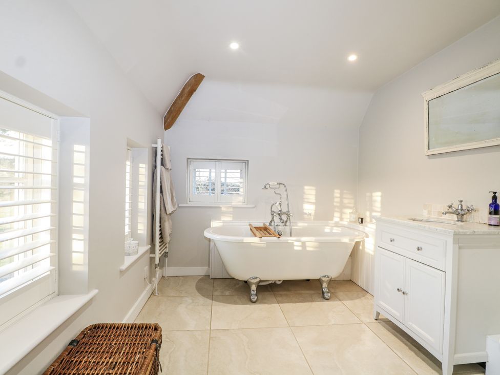 A bathroom with a bathtub and sink at Farm house in 