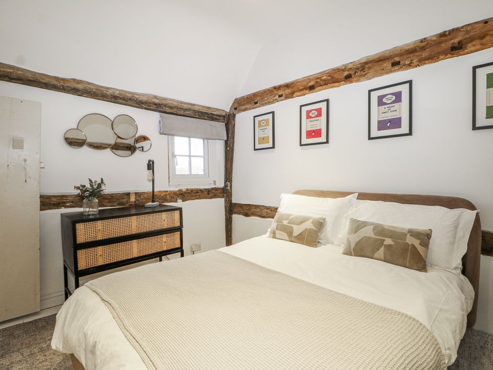 A bedroom with a bed and a dresser at Farm house 