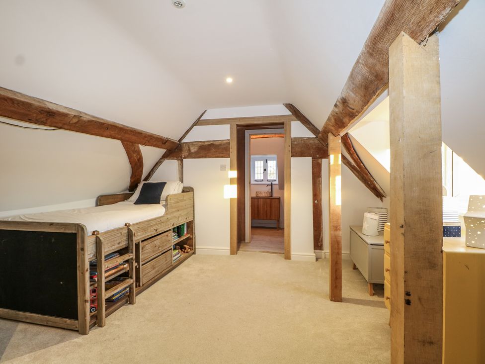 A bedroom with a bed and furniture at Farm house 