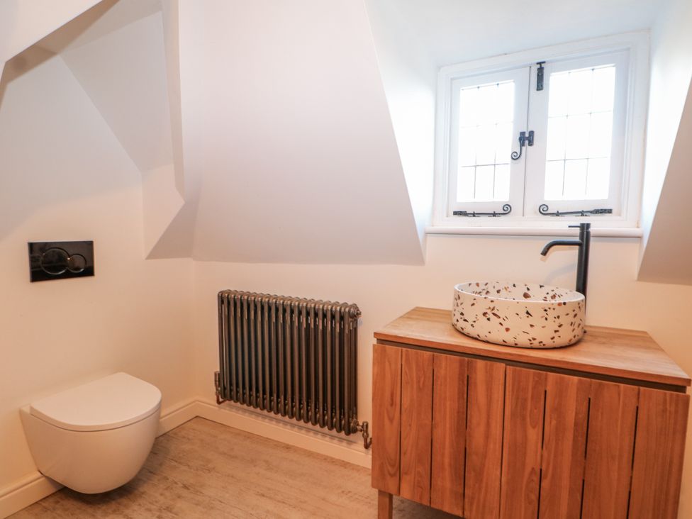 A bathroom with a sink and toilet at Farm house