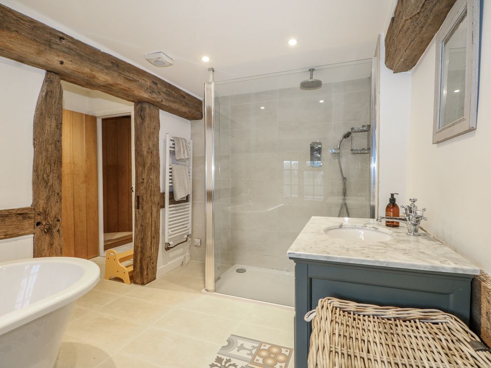 A bathroom with a shower and sink at Farm house
