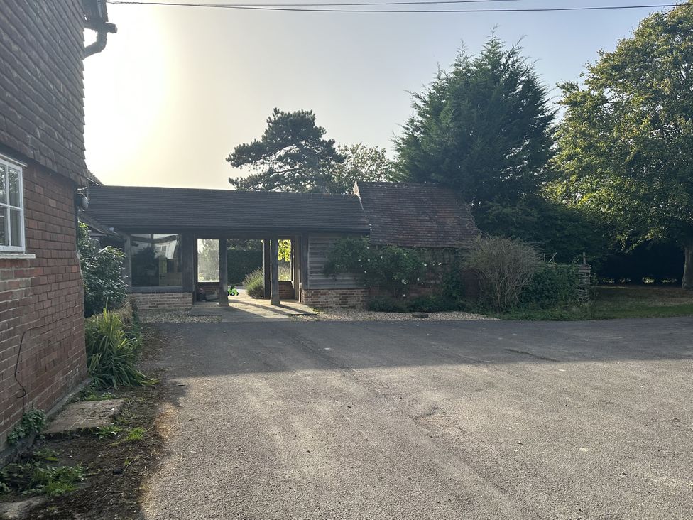 An outdoor area with a carport and driveway at the Farm house 