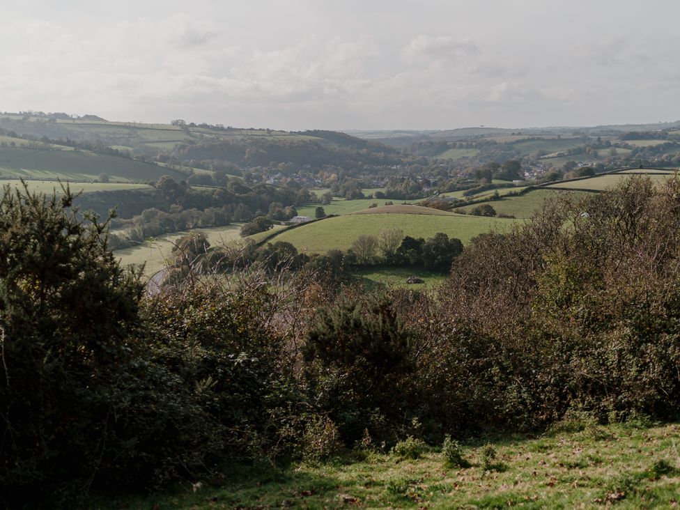 A landscape view of hills and fields at Holwell Farmhouse in Bampton