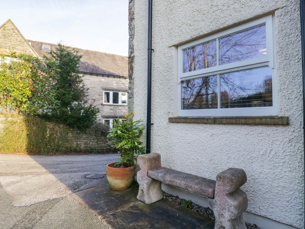 An outdoor area with a stone bench and plant pot at 11 Tram Lane Kirkby Lonsdale