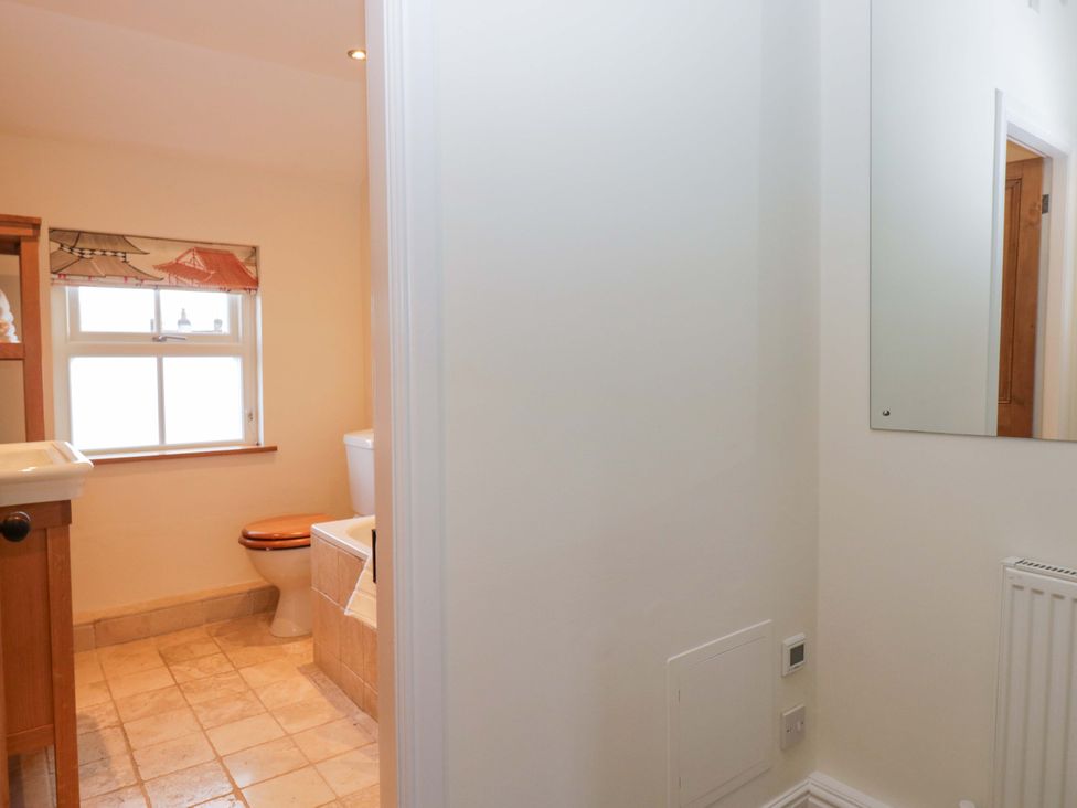 A bathroom with a sink and toilet at 11 Tram Lane in Kirkby Lonsdale