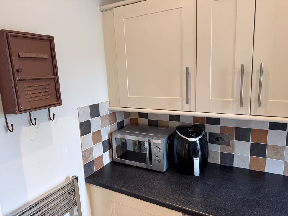 A kitchen with a microwave and air fryer at New House Barn in Ashbourne