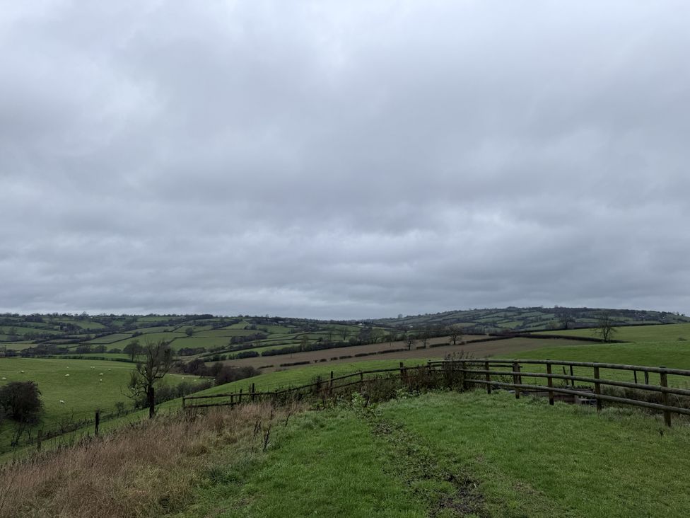 A landscape view of hills and a fence at New House Barn Ashbourne