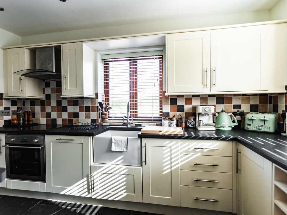 A kitchen with various appliances and cabinets at New House Barn in Bradley near Ashbourne