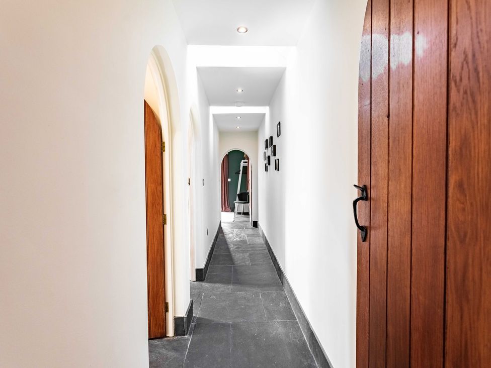 A hallway with doors and lights at New House Barn in Bradley near Ashbourne
