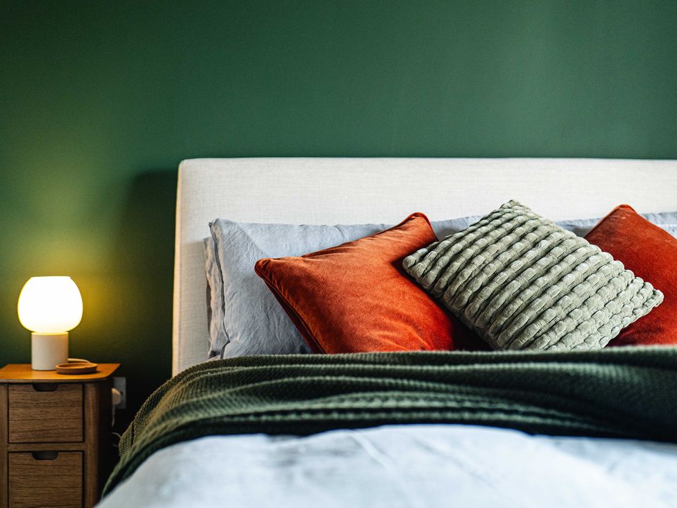 A bedroom with a bed and pillows at New House Barn in Bradley near Ashbourne